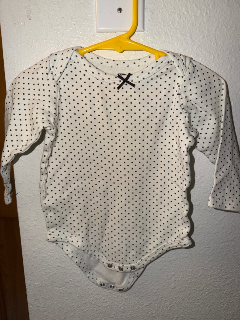 Long-Sleeve White Dot Baby Bodysuit with Black Trim